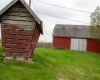 Corn crib & view of the upper entrance of the Bank Barn.