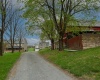 Long driveway welcomes you to your private paradise.