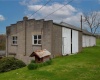 2nd concrete barn - showing upper level access - 15' barn door.