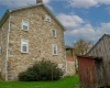 Side of the house with the walk-out door