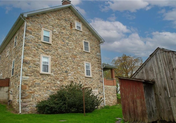 Side of the house with the walk-out door