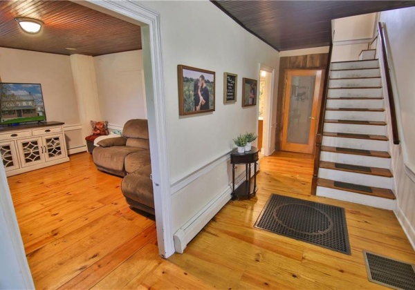 Inside you'll find refinished wood floors, tall ceilings and authentic farmhouse charm.