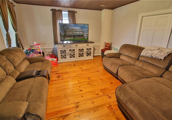 Spacious Living room with bead board ceilings