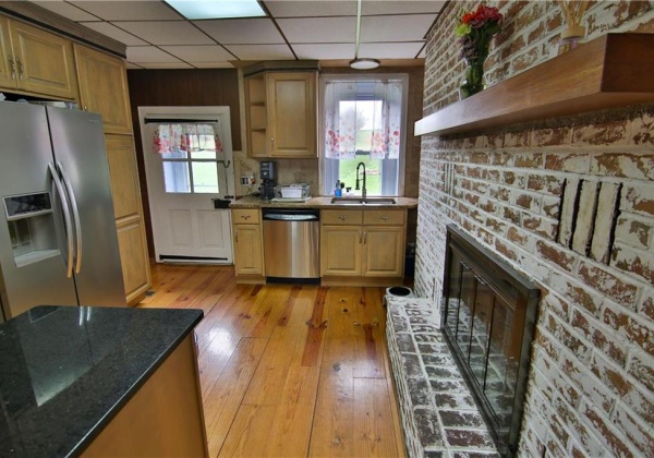 Kitchen has access to rear porch