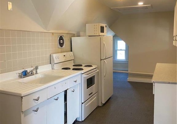 galley kitchen with dining area