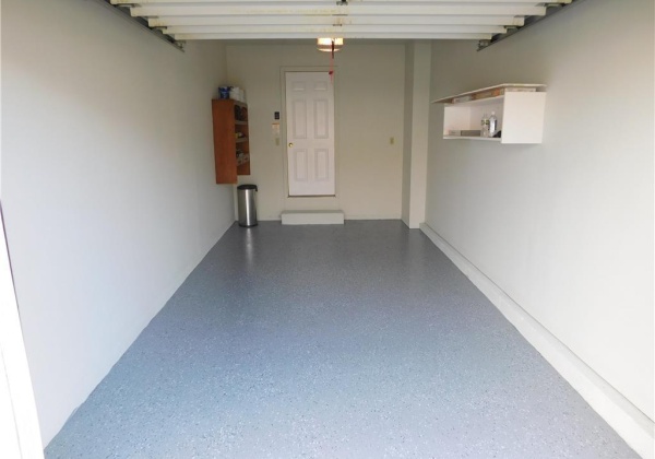 Built-In Garage with an Opener & Epoxy Floor